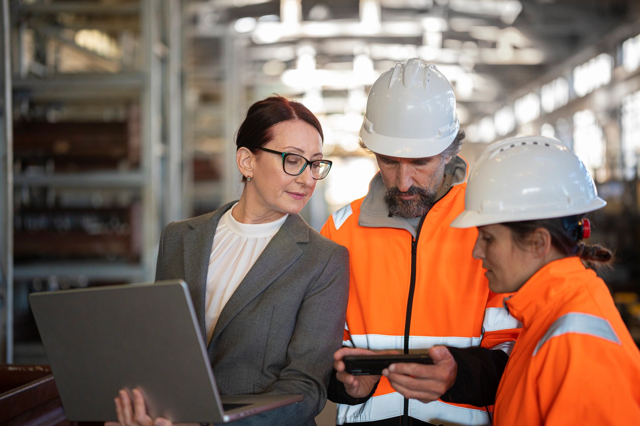 Manufacturing team reviewing AI and operations data